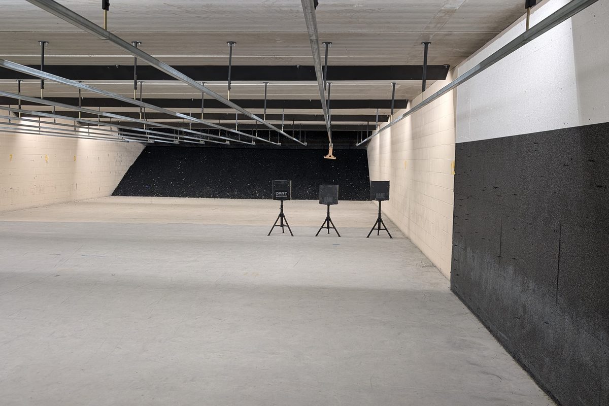 A DART three-target lane deployed down a commercial indoor range bay